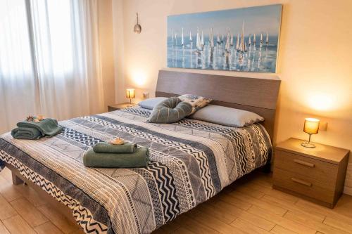 a bedroom with a bed with two pillows on it at Casa Vacanza TDL in Torre del Lago Puccini