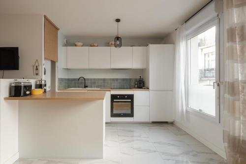 Foto Appartement Calme en Centre-ville avec Parking 4