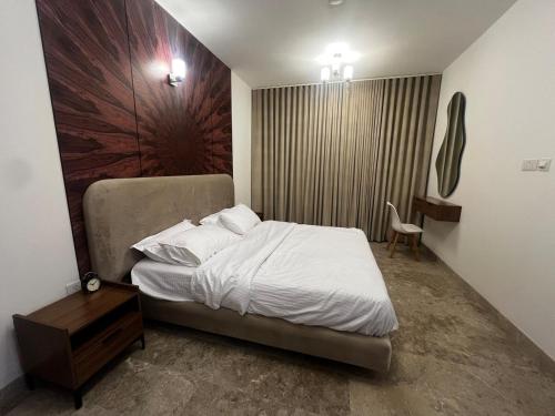 Postel nebo postele na pokoji v ubytování Mazaya VIP Stay