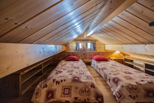 Ένα ή περισσότερα κρεβάτια σε δωμάτιο στο Chalet Le Hors Piste