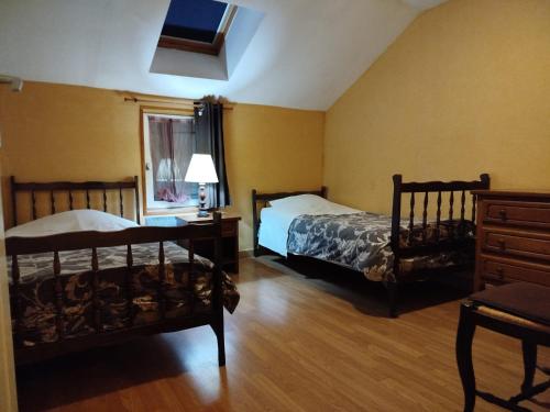 Postel nebo postele na pokoji v ubytování Gîte Chez Albertine