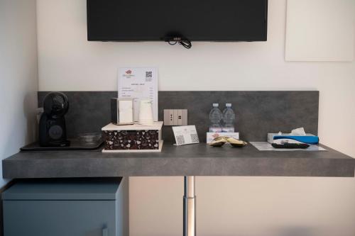 a counter top with items on top of it at Rosa Rooms Pompei in Pompei