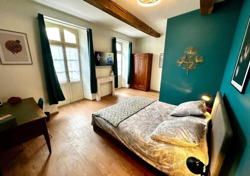 En eller flere senge i et værelse på Eucalyptus - Élégance près du circuit de Nogaro