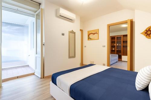 Postel nebo postele na pokoji v ubytování Appartamento Mansarda Bellaria - MyHo Casa