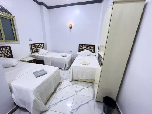 Postel nebo postele na pokoji v ubytování Anas Nubian Geust House