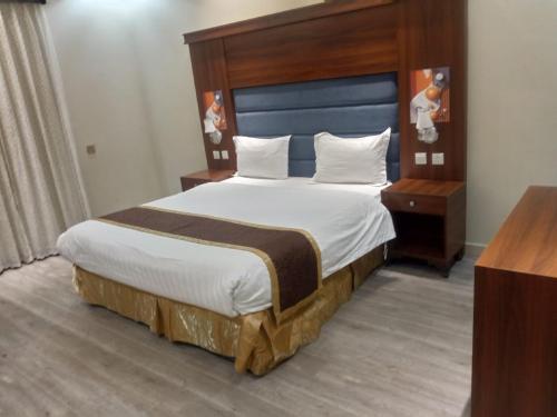 En eller flere senge i et værelse på ليالي أكنان للشقق المخدومة فرع2