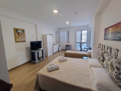 TV a/nebo společenská místnost v ubytování Finestra del mare