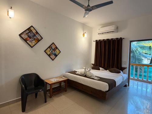 Postel nebo postele na pokoji v ubytování Aura rooms & swimming pool, calangute