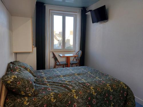 En eller flere senge i et værelse på Sérénité 1