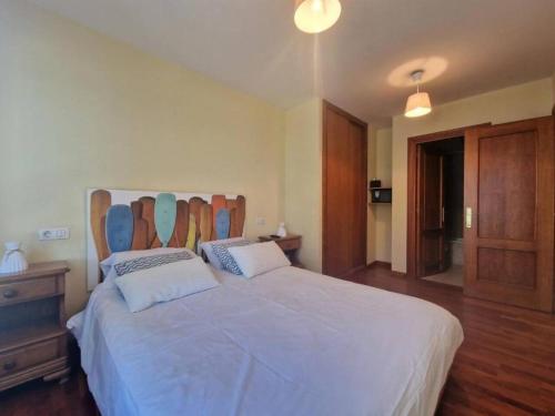 En eller flere senge i et værelse på Apartamento El Rinconín Selnatur