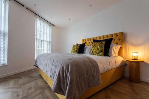 a bedroom with a large bed and a window at St James Central Splendor in Bath