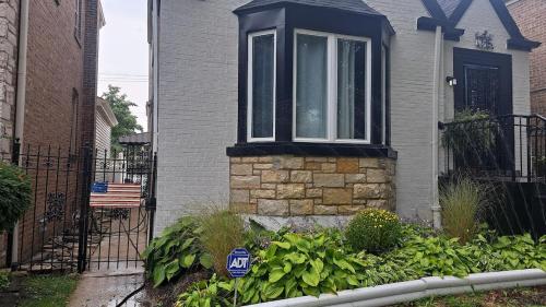 a house with a window on the side of it at Beautiful basement in Chicago