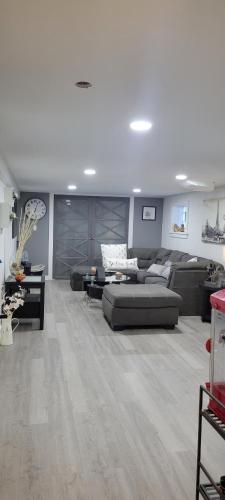 a living room with a couch and a table at Beautiful basement in Chicago