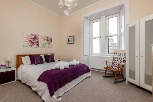 En eller flere senge i et værelse på Bonny Bay - Lower Largo