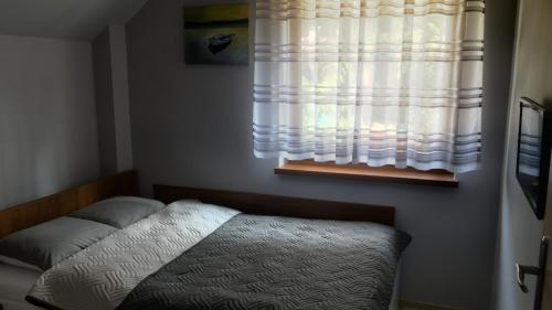 Postel nebo postele na pokoji v ubytování Grey House