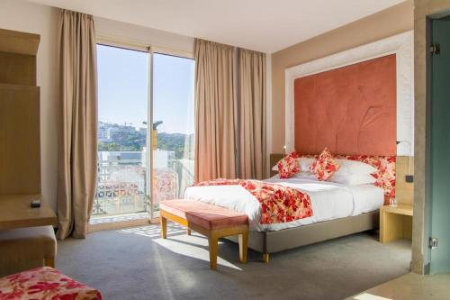 Postel nebo postele na pokoji v ubytování Mandarin Palace Hotel & Spa