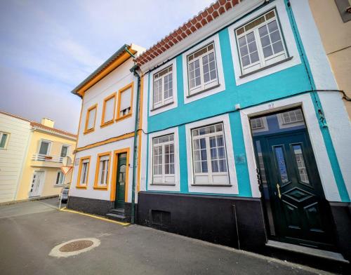a blue and white building on a street at Downtown Guesthouse in Angra do Heroísmo