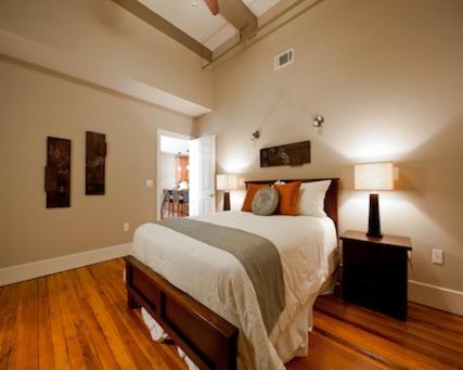 a bedroom with a large bed in a room at The Valley in Vicksburg