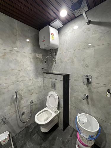 a bathroom with a toilet and a sink at Hotel ELITE CHOICE in Ajmer
