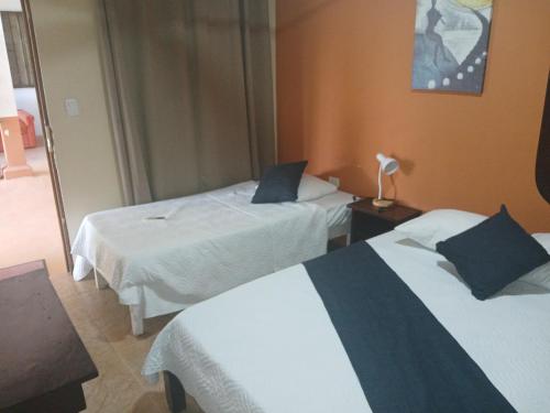 Giường trong phòng chung tại Hotel El Cocobolo Food&Rest Room 3 B&B WiFi AC Pkg Free Swimmingpool