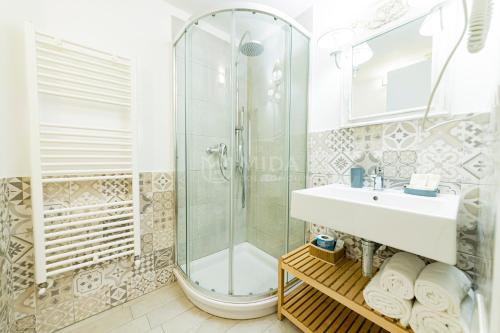 a bathroom with a shower and a sink at InCentro b&b in Porto Cesareo