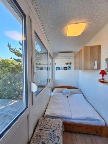 En eller flere senge i et værelse på Bruno Apartment