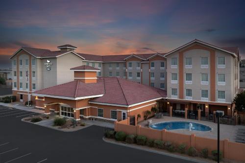 a rendering of a hotel building with a pool at Homewood Suites by Hilton Yuma in Yuma