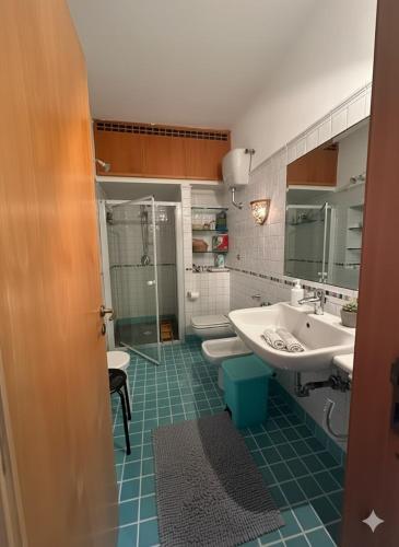 a bathroom with a sink and a shower and a toilet at Casa di Lorena - Dream view in Maiori