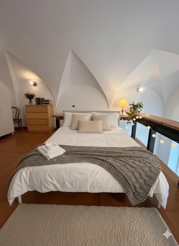 a bedroom with a large bed in a attic at Casa di Lorena - Dream view in Maiori