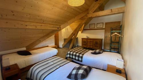 En eller flere senge i et værelse på Maison Féli'