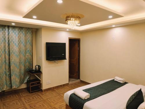 TV a/nebo společenská místnost v ubytování Hotel oscar Mountain Retreat