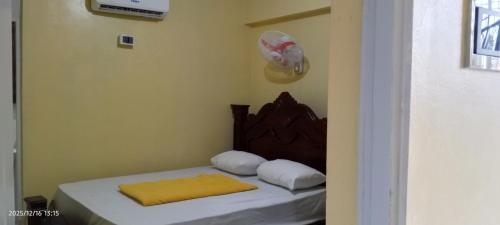 Ένα ή περισσότερα κρεβάτια σε δωμάτιο στο Habitaciones privadas en Higüey Hotel San Marcos