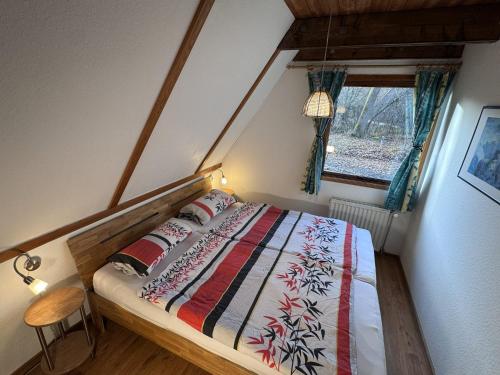 En eller flere senge i et værelse på Twiste Retreat 126