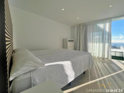 Postel nebo postele na pokoji v ubytování Los Roquitos II