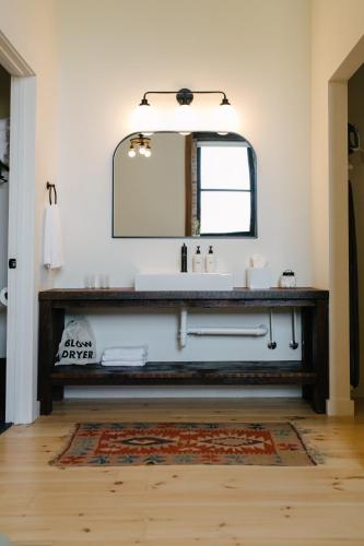 a bathroom with a sink and a mirror at Hotel Royal in Toledo