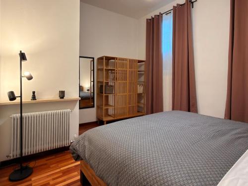 Postel nebo postele na pokoji v ubytování Historic residence - Center of Cividale & parking