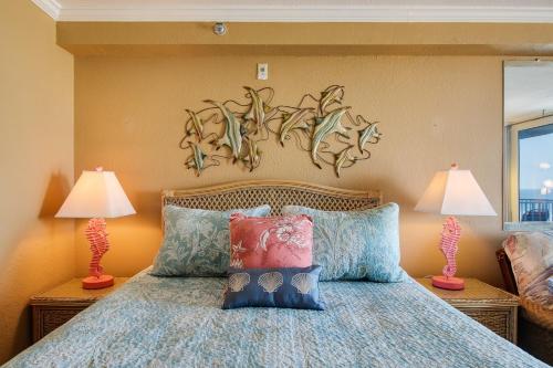 a bedroom with a bed with two lamps at Daytona Beach in Daytona Beach