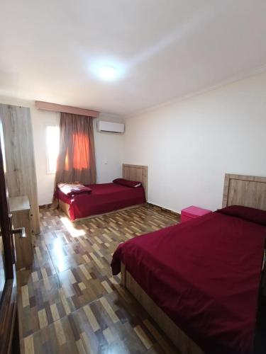 Postel nebo postele na pokoji v ubytování Sheraton Palace 1