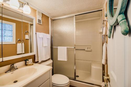 a bathroom with a toilet sink and a shower at Daytona Beach in Daytona Beach