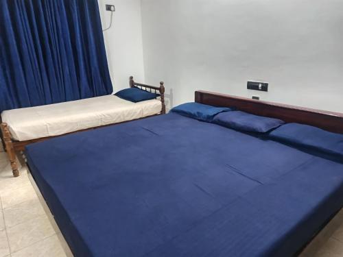 Postel nebo postele na pokoji v ubytování Poonthanam guest house