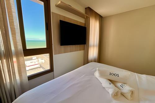 En eller flere senge i et værelse på VISTA MAR Encantadora Conforto e Estilo