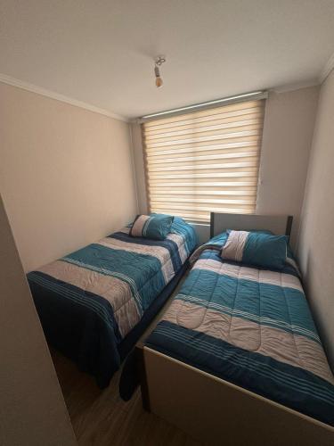 Postel nebo postele na pokoji v ubytování Viña del mar