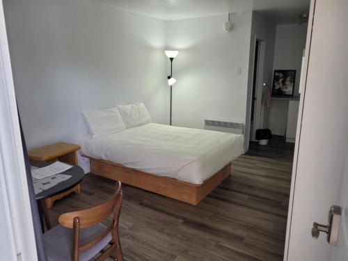 Postel nebo postele na pokoji v ubytování Hébergements ASLC Baie-Comeau