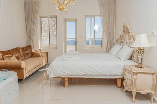 En eller flere senge i et værelse på Moses Luxury apartments 60 a