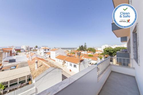 a view of the city from the balcony of a building at C09 - Portimão 3 Bed Holiday Apartment in Portimão
