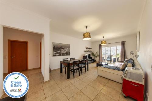 a living room with a couch and a table at C02 - Luxury 3 Bed With Pool View in Lagos