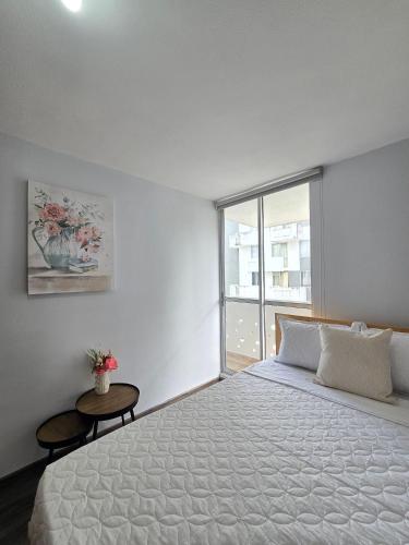 Postel nebo postele na pokoji v ubytování Más de 30 Apartamentos Privados en el Quindío con PISCINA