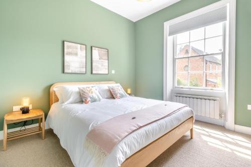 a bedroom with a large bed and a window at 3 Bed in Cyfronydd oc-e32742 in Llanfair Caereinion