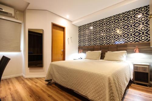 En eller flere senge i et værelse på Hotel Biz Urban- EXPO CENTER NORTE