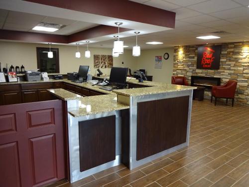 a large lobby with a bar in a store at Red Roof Inn Indianapolis - Castleton in Indianapolis